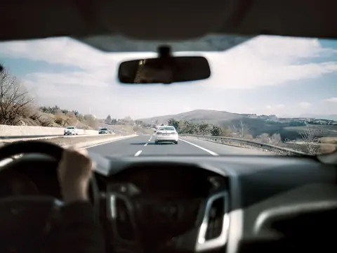 Traffic on a divided highway, seen through the windshield